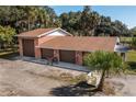 Three-car brick garage with additional covered area at 4911 W Sam Allen Rd, Plant City, FL 33565