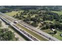 Overhead angle showcasing a spacious lot with a charming home next to highway access at 750 Charlie Taylor Rd, Plant City, FL 33566