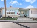 Charming single-story home with a covered parking area and well-maintained landscaping at 250 Rosery Nw Rd # 260, Largo, FL 33770
