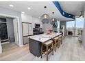 Modern kitchen with island seating, stainless appliances, and an open concept layout at 777 N Ashley Dr # 2313, Tampa, FL 33602