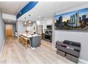 Modern kitchen with large island, stainless appliances, and an entertainment setup at 777 N Ashley Dr # 2313, Tampa, FL 33602