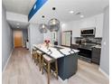 Modern kitchen features a large island, stainless appliances, and stylish pendant lighting at 777 N Ashley Dr # 2313, Tampa, FL 33602