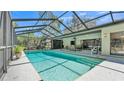 Stunning screened-in pool and patio area, perfect for outdoor entertaining and relaxation at 1316 Cambron Dr, Valrico, FL 33596