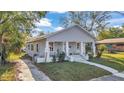 Beautiful single-story home offering a lovely front porch and well-maintained lawn at 3105 N 17Th St, Tampa, FL 33605