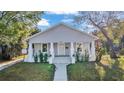 Inviting single-story home boasting a quaint front porch with traditional white columns at 3105 N 17Th St, Tampa, FL 33605