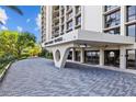 Elegant entrance to Monte Carlo Towers with covered drop-off and attractive brick driveway at 3301 Bayshore Blvd # 503, Tampa, FL 33629