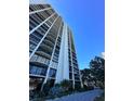 Tall building with expansive balconies offering views, surrounded by trees and lush landscape at 3301 Bayshore Blvd # 503, Tampa, FL 33629