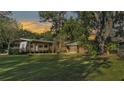 Large backyard featuring an RV and screened-in porch, perfect for outdoor living at 4142 El Shaddiai Sq, Plant City, FL 33565
