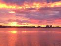 Scenic sunset over water, featuring a vibrant sky with pink and orange hues at 1140 Boca Ciega Isle Dr, St Pete Beach, FL 33706