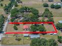 Aerial view of property showing the home, outbuildings, and boundary lines at 18818 Dorman Rd, Lithia, FL 33547