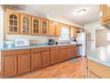 Traditional kitchen with wood cabinets, laminate countertops, and stainless steel appliances at 18818 Dorman Rd, Lithia, FL 33547