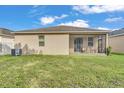Large backyard with a screen enclosed patio, perfect for outdoor relaxation and entertainment at 3134 Macintosh Rd, Land O Lakes, FL 34639