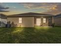 Large backyard with a screen enclosed patio, perfect for outdoor relaxation and entertainment at 3134 Macintosh Rd, Land O Lakes, FL 34639