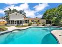 Relaxing backyard featuring a private swimming pool and patio area perfect for outdoor entertainment at 114 Windy Pl, Brandon, FL 33511