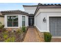 Beautiful exterior view highlighting the front entrance, stone accents, and well-manicured landscaping at 20159 Umbria Hill Dr, Tampa, FL 33647