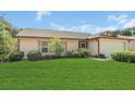 Charming single-story home with a well-manicured lawn and attached two-car garage at 625 Chilt Dr, Brandon, FL 33510
