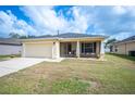 Charming one-story home featuring a two-car garage, well-maintained lawn, and a screened-in front porch at 727 Vineyard Reserve Ct, Seffner, FL 33584