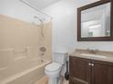 Simple bathroom with a tub/shower combination and a dark wood vanity at 3205 N 66Th St, Tampa, FL 33619