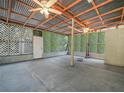 Enclosed patio with concrete flooring and an open beam ceiling, perfect for entertaining at 3205 N 66Th St, Tampa, FL 33619