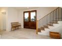 Welcoming foyer with staircase, stylish decor, and a glimpse of the outdoors at 531 68Th St, Holmes Beach, FL 34217