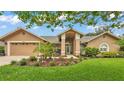 Beautiful single-Gathering home with manicured lawn and covered entryway at 2912 Aston Ave, Plant City, FL 33566
