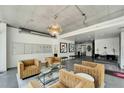A welcoming lobby with comfortable seating, a modern chandelier, and mailboxes for residents at 101 S 12Th St # 318, Tampa, FL 33602