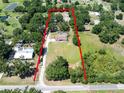 Expansive aerial view of the property, highlighting the home, pool, and surrounding greenery at 7608 Franklin Rd, Plant City, FL 33565