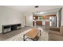 Open living space with neutral paint, and combined kitchen at 1018 Briarwood Ave, Tampa, FL 33613
