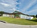 Single-story home with large yard and white fence at 1201 Lavender Jewel Ct, Plant City, FL 33563
