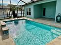 Relaxing pool with mosaic tile accents at 1201 Lavender Jewel Ct, Plant City, FL 33563
