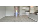 Spacious living area showcasing tile flooring, ample natural light, and an open layout at 3188 Nubbin Ridge Ln, Zephyrhills, FL 33540