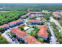 A large condominium complex with a pool, tennis court, and ample parking nestled in a wooded area at 18001 Richmond Place Dr # 337, Tampa, FL 33647