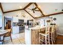 Bright, open kitchen with stainless appliances, breakfast bar, and eat-in dining area at 2223 Wildwood Hollow Dr, Valrico, FL 33596