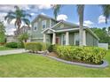 Charming home with well-maintained landscaping, a lush green lawn, and a classic front facade at 2721 Walden Woods Dr, Plant City, FL 33566