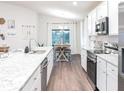 Modern kitchen featuring stainless steel appliances and granite countertops at 7019 161St E Ter, Parrish, FL 34219