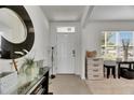 Bright foyer featuring tile flooring and a view of the front door at 503 Arbequina Ct, Plant City, FL 33566