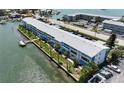 Waterfront condo with canal access, boat docks, and lush landscaping at 1893 Shore S Dr # 208, South Pasadena, FL 33707