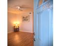 Bright living room with wood floors, ceiling fan, and neutral paint, creating a cozy atmosphere at 1893 Shore S Dr # 208, South Pasadena, FL 33707