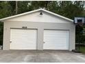 Spacious two-car garage with a basketball hoop, offering ample parking and recreational space at 4818 Huron St, Zephyrhills, FL 33541