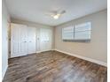 Clean and bright bedroom featuring stylish wood-look floors and ample closet space at 5980 80Th N St # 408, St Petersburg, FL 33709