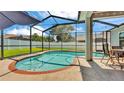 Inviting pool with screened enclosure, perfect for enjoying the outdoors at 3911 Smoke Rise Ct, Valrico, FL 33594
