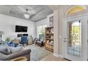 Inviting office space with modern furnishings, a stylish chandelier, and ample natural light at 11825 Frost Aster Dr, Riverview, FL 33579