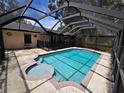 Relaxing screened-in pool with a spa and ample deck space is perfect for outdoor enjoyment at 12212 Hidden Brook Dr, Tampa, FL 33624
