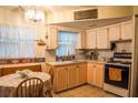 Cozy kitchen featuring ample counter space, essential appliances, and a dining area at 7713 39Th N Ave, St Petersburg, FL 33709