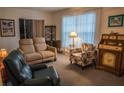 Inviting living room is furnished with comfortable seating, and natural light at 7713 39Th N Ave, St Petersburg, FL 33709