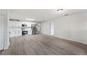 Open-concept kitchen featuring stainless steel appliances and bright flooring at 2633 Keysville Dr, Lithia, FL 33547