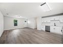 Spacious living room and modern kitchen with ample natural light and new stainless appliances at 2633 Keysville Dr, Lithia, FL 33547