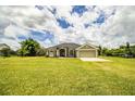 Charming single-story home with a well-manicured lawn and attached two-car garage at 3730 Ralston Rd, Plant City, FL 33566