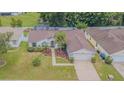 Overhead view of landscaped property featuring well-maintained lawn, mature landscaping and screened-in pool at 4223 Amber Ridge Ln, Valrico, FL 33594