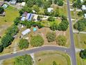 Bird's eye view of home highlighting its backyard with pool and surrounding landscape in a quiet residential area at 12410 Myrtlewood Dr, Riverview, FL 33579